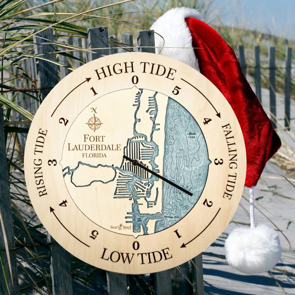 Fort Lauderdale Tide Clock Birch Accent with Blue Green Water Hanging on Fence with Santa Hat