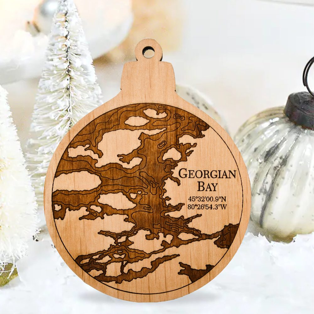 Georgian Bay Engraved Nautical Ornament Sitting on Table by Silver Christmas Ornaments
