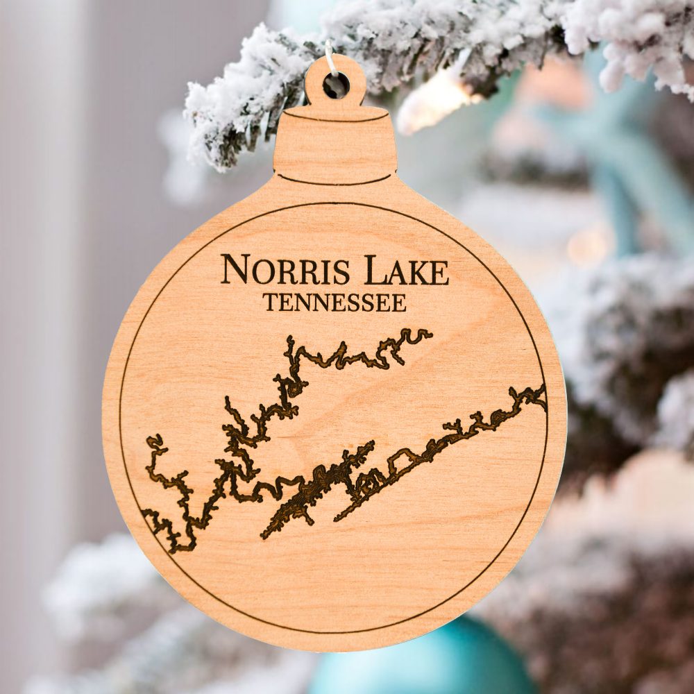 Norris Lake Engraved Nautical Ornament Hanging on Outdoor Pine Tree with Snow