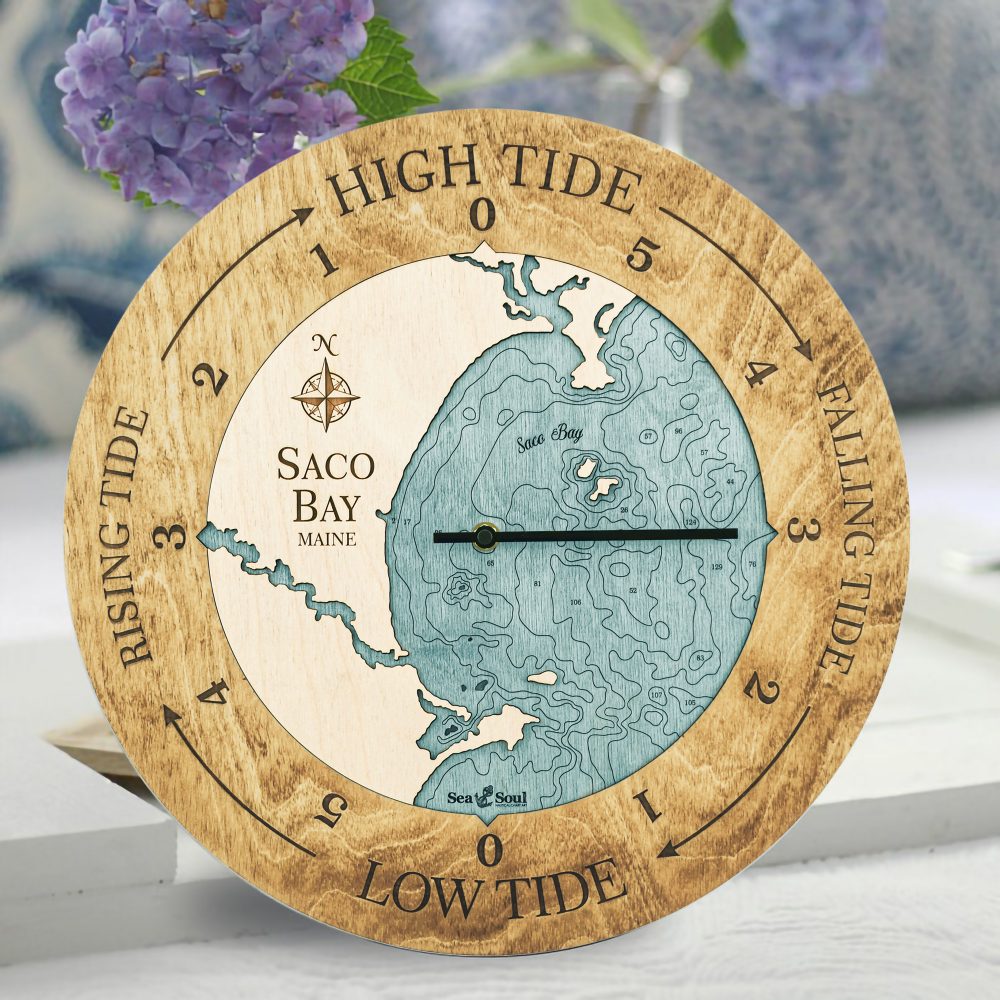 Saco Bay Tide Clock Honey Accent with Blue Green Water Sitting on Table with Flowers