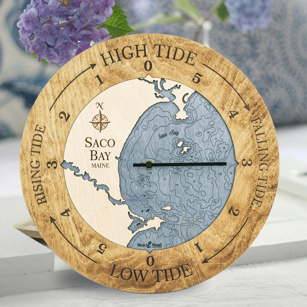 Saco Bay Tide Clock Honey Accent with Deep Blue Water Sitting on Table with Flowers