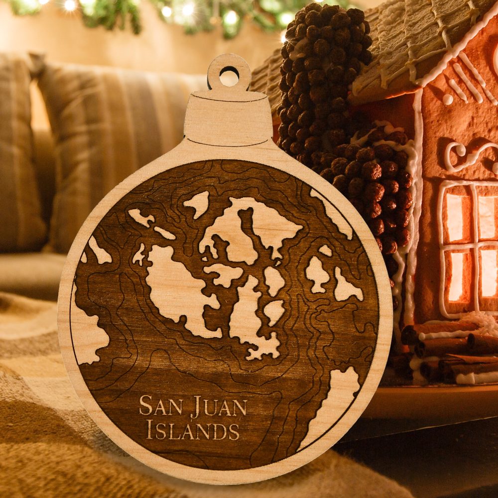 San Juan Engraved Nautical Ornament Sitting on Table by Gingerbread House