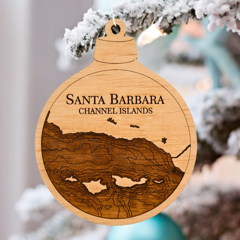 Santa Barbara Engraved Ornament Hanging on Pine Tree Outdoors with Snow