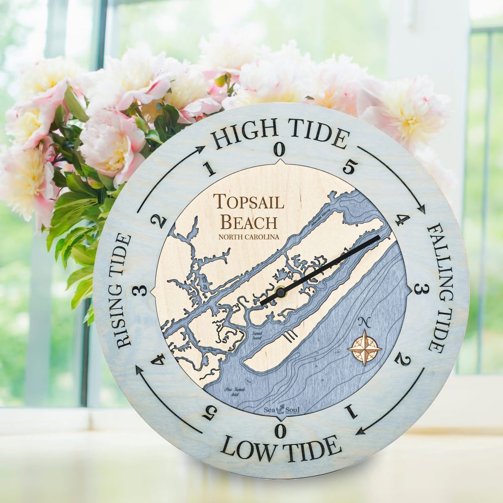 Topsail Beach Tide Clock Bleach Blue Accent with Deep Blue Water Sitting on Windowsill with Flowers