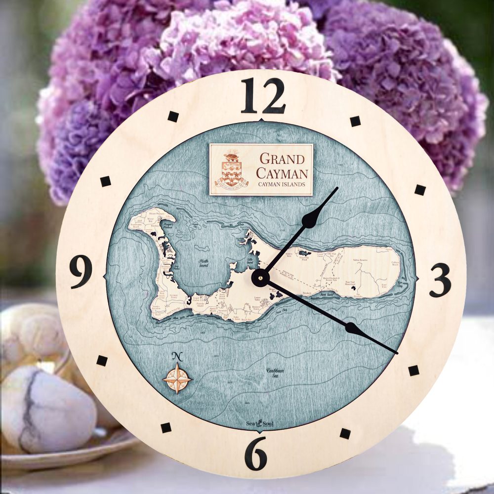 Grand Cayman Nautical Map Clock Birch Accent with Blue Green Water Sitting on Table with Flowers