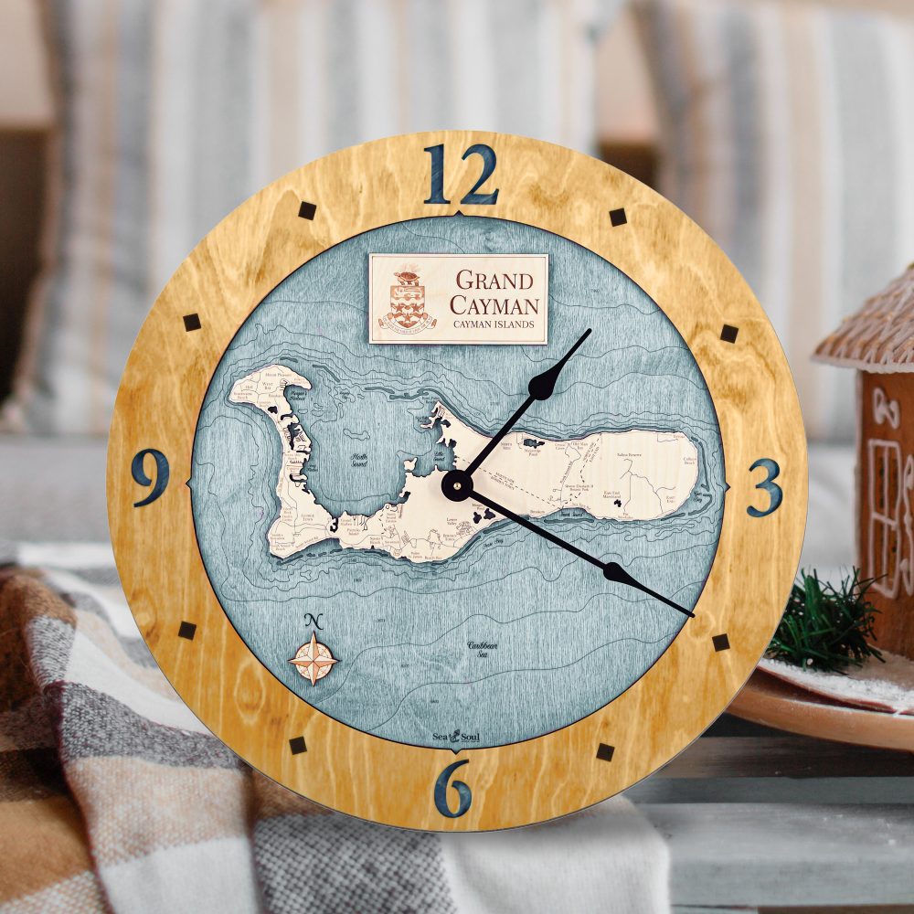 Grand Cayman Nautical Map Clock Honey Accent with Blue Green Water Sitting on Coffee Table on Blanket by Gingerbread House