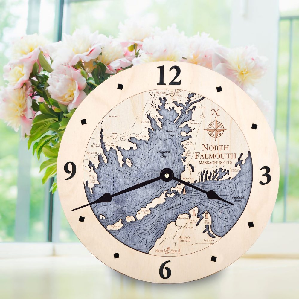 North Falmouth Nautical Map Clock Birch Accent with Deep Blue Water Sitting on Windowsill with Flowers